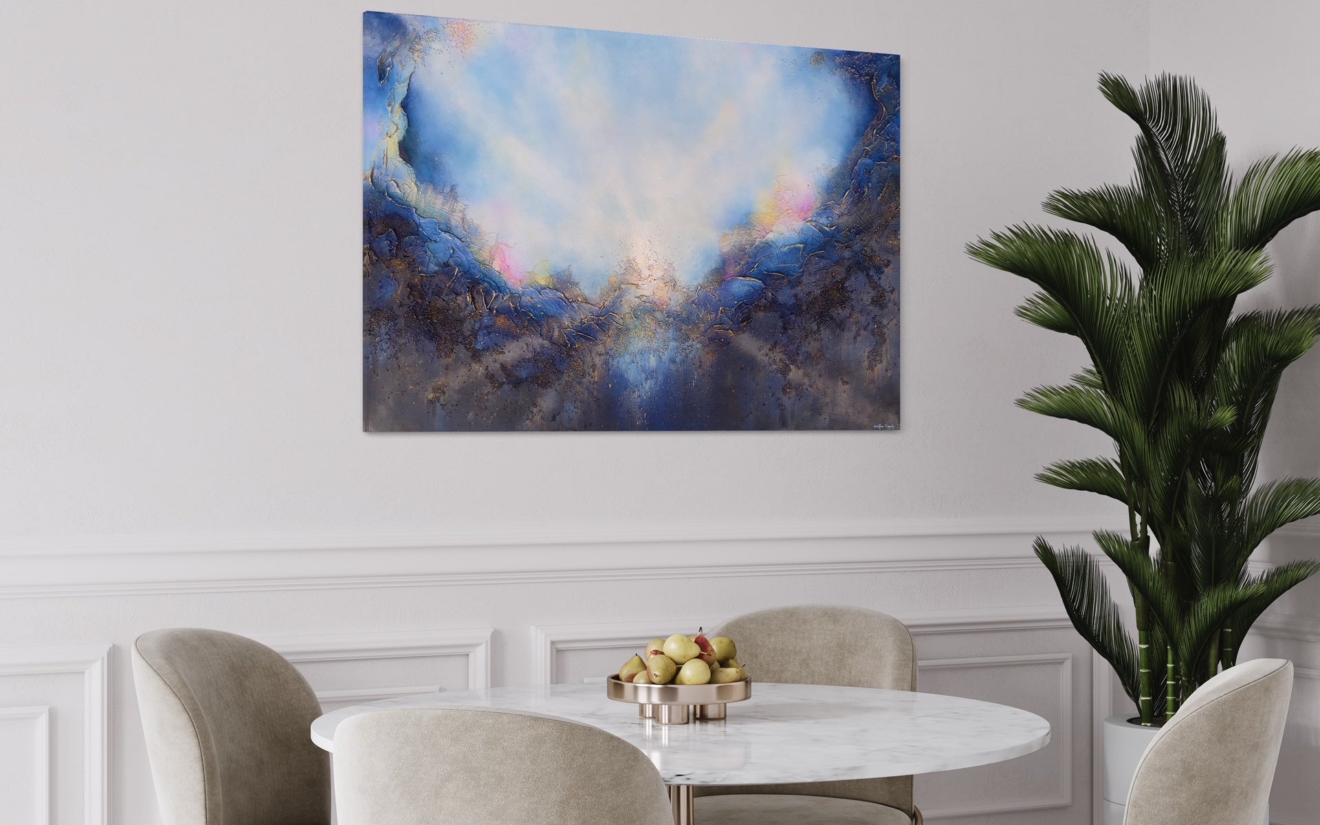 Soul's Return, hanging over a white table in a dining room with white walls, wainscotting, and deep green plants. a textured painting with light rays shining out from the center representing the soul's return to one's self, or the universe. Blue, pink, white, dark blue, textured painting. Ephemeral art, art with meaning, soul artist. Jennifer Tepper Fine Art.