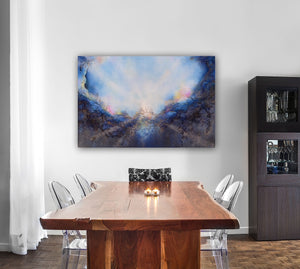 Soul's Return, hanging above a rustic dining room table with live edges and candles. a textured painting with light rays shining out from the center representing the soul's return to one's self, or the universe. Blue, pink, white, dark blue, textured painting. Ephemeral art, art with meaning, soul artist. Jennifer Tepper Fine Art.
