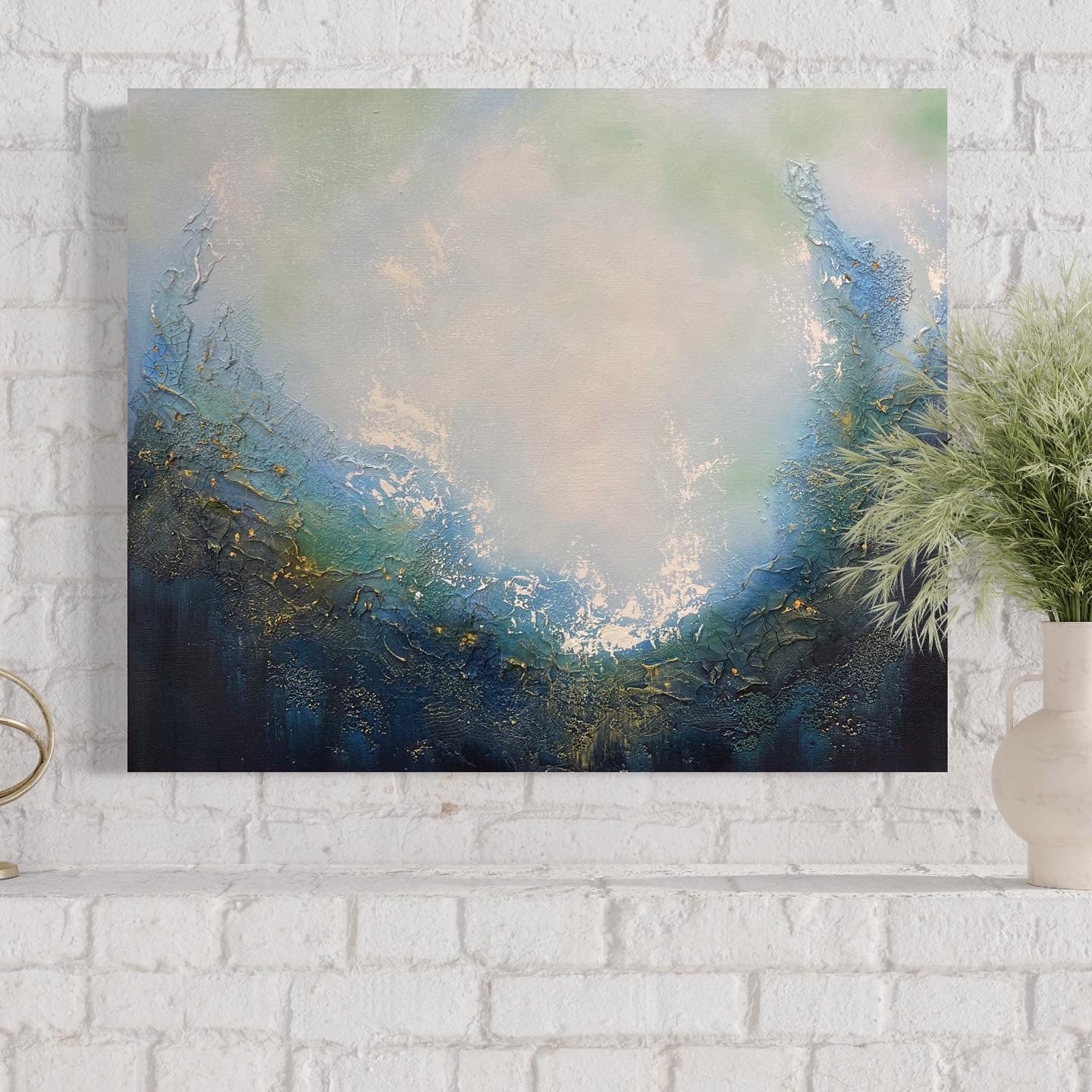 This stunning original abstract painting evokes a feeling of soulful peace and beckons a return to your spiritual center. Dive in and explore this portal which invites personal reflection with its powerful imagery of a magical portal opening up to a realm of endless possibilities. Painting hangs on the mantle of a white brick fireplace.