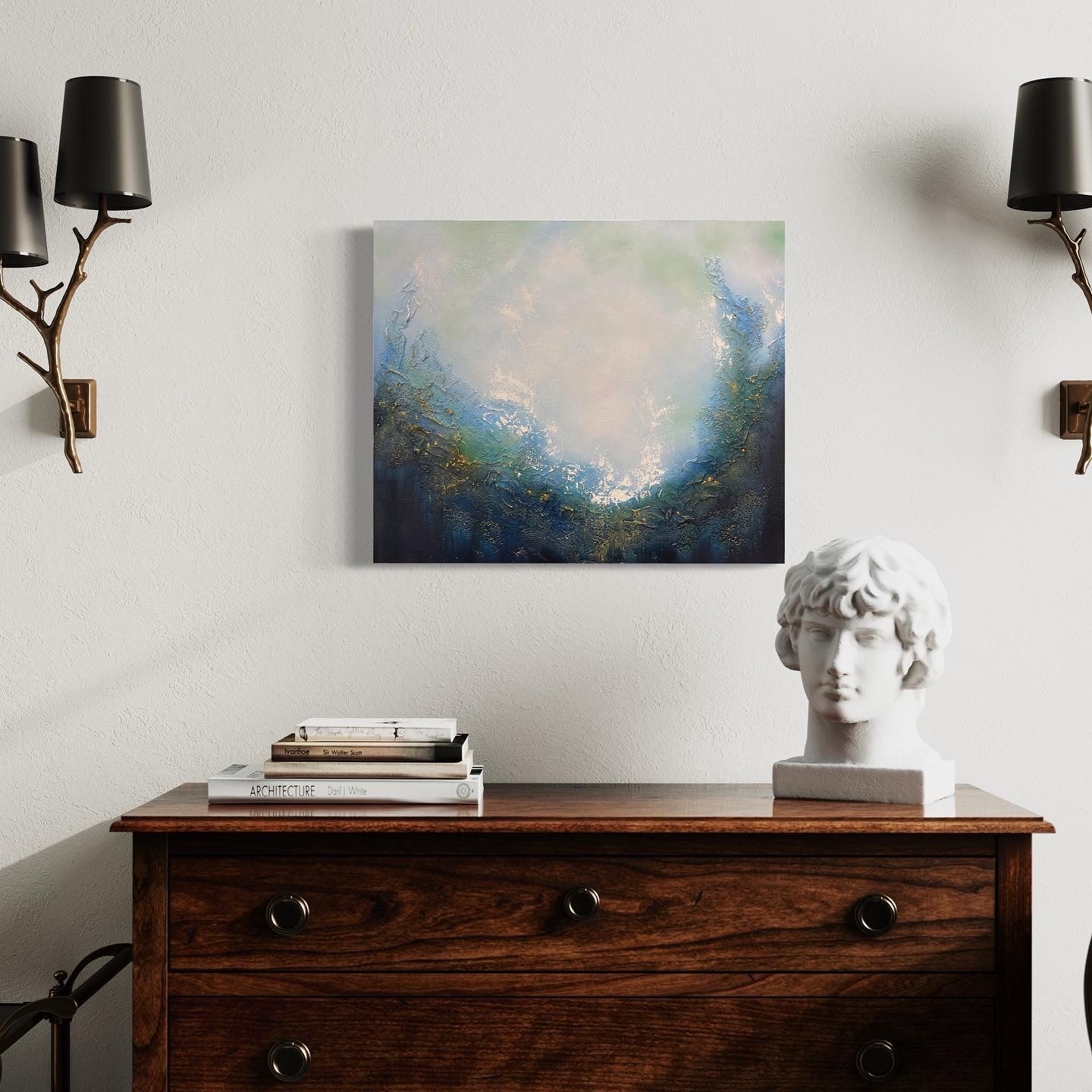This stunning original abstract painting evokes a feeling of soulful peace and beckons a return to your spiritual center. Dive in and explore this portal which invites personal reflection with its powerful imagery of a magical portal opening up to a realm of endless possibilities. Painting hangs over a wooden credenza with marble bust and books, with wall lamps on either side shaped like tree limbs.